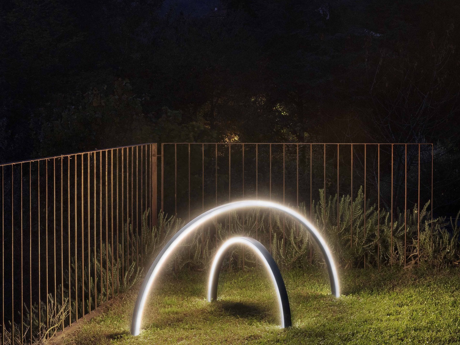 Zirkol Outdoor arcs beside a garden fence